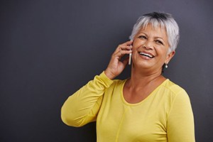 Smiling older woman talking on the phone