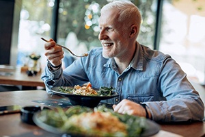 Mature man eating a nutritious, tasty meal