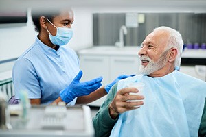 Dental patient and team member enjoying friendly interaction