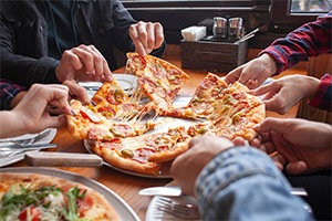 Friends sharing a pizza